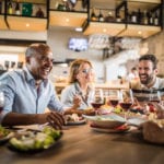 Friends enjoy restaurants near Dunes Village Resort