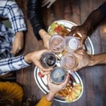 Friends cheers while dining at the Market Common