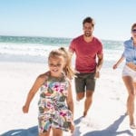 Family playing on the beach one of the 5 free things to do in Myrtle Beach