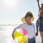 Family playing on the beach - one of the family friendly activities in Myrtle Beach