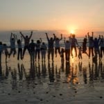 Family posing for beach picture during a family reunion in Myrtle Beach