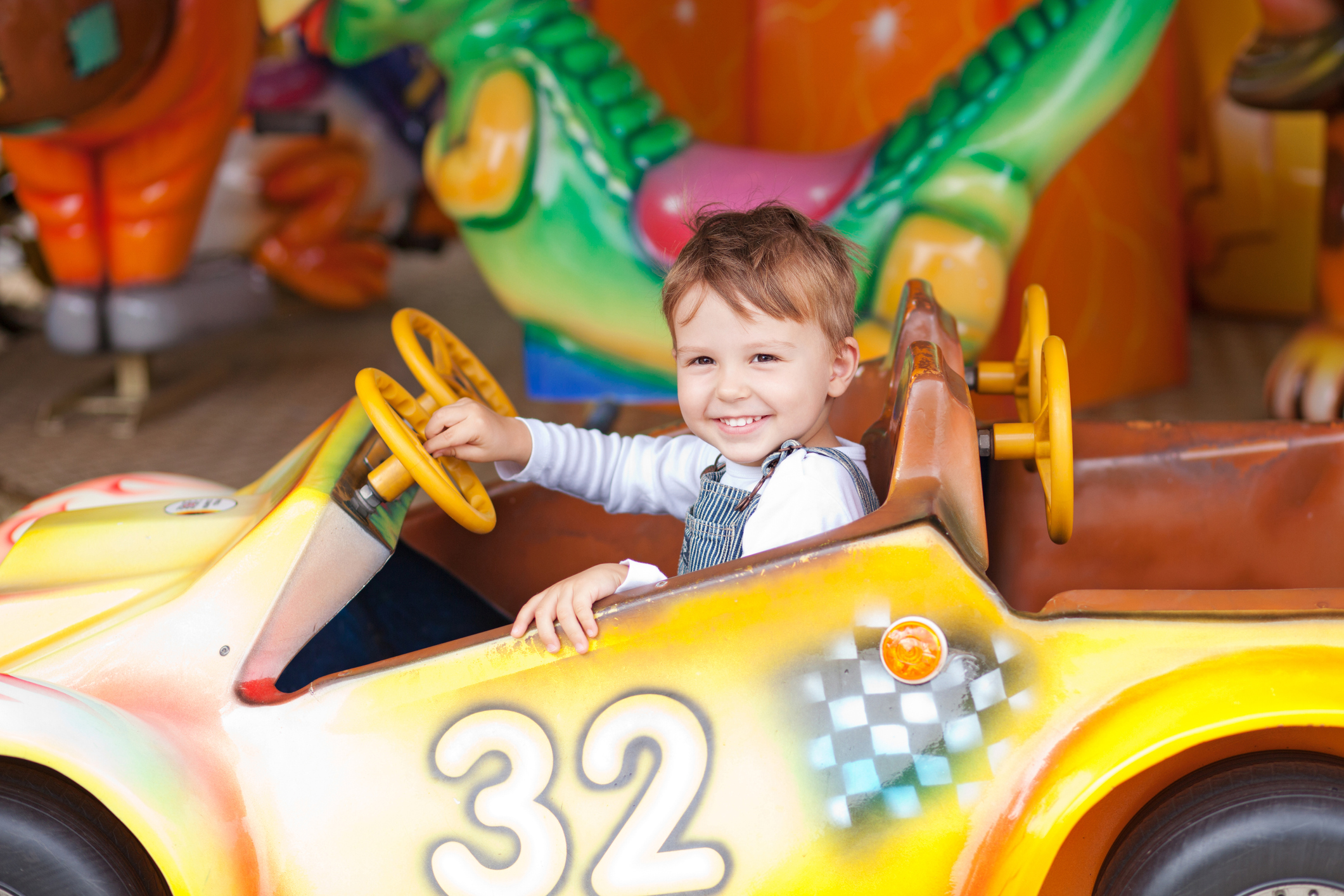 Toddler on a carousel.