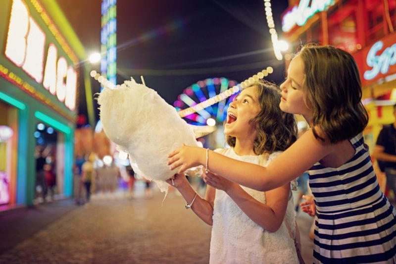 Girls eating cotton candy - family friendly entertainment in Myrtle Beach