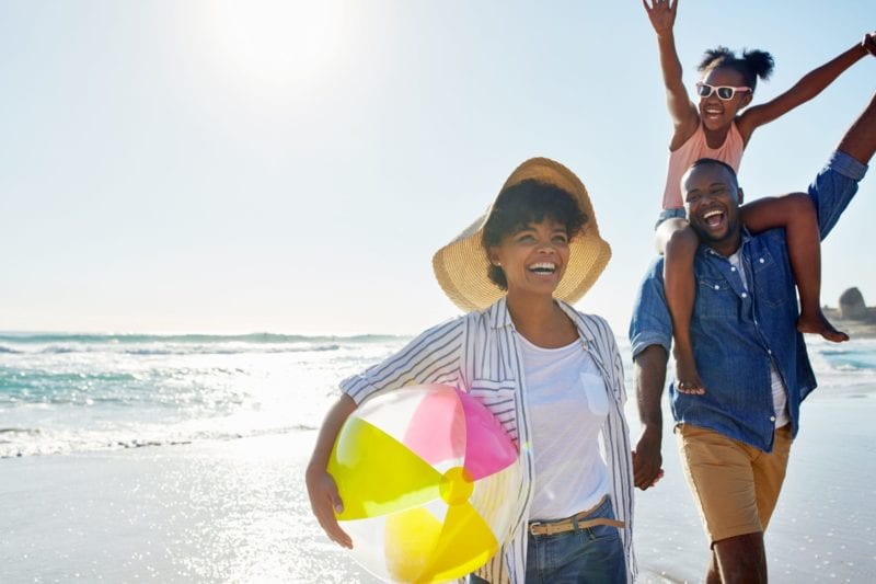 Family playing on the beach - one of the family friendly activities in Myrtle Beach