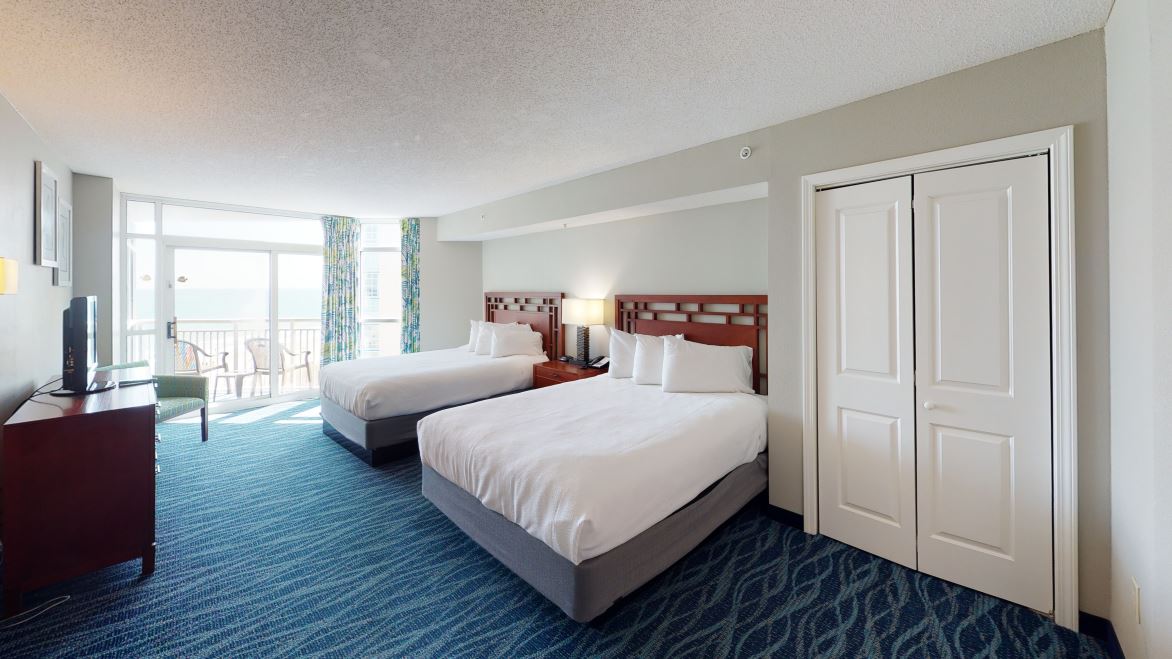 Oceanfront bedroom with two beds at Dunes Village Resort Myrtle Beach.