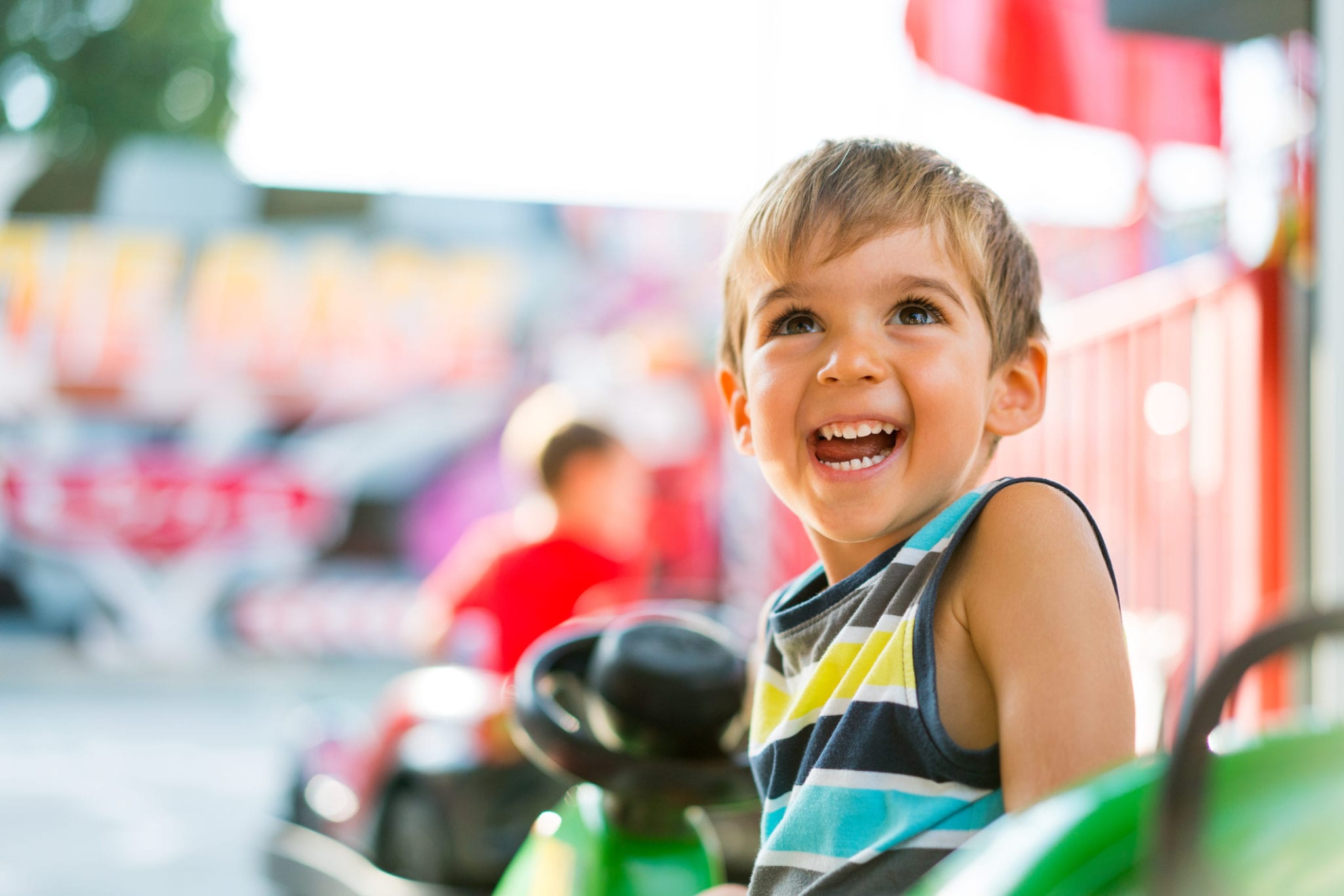 toddler enjoy an amusement park