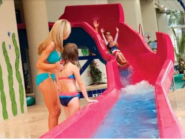 Girl sliding down water slide at Dunes Village Resort Waterpark in Myrtle Beach.